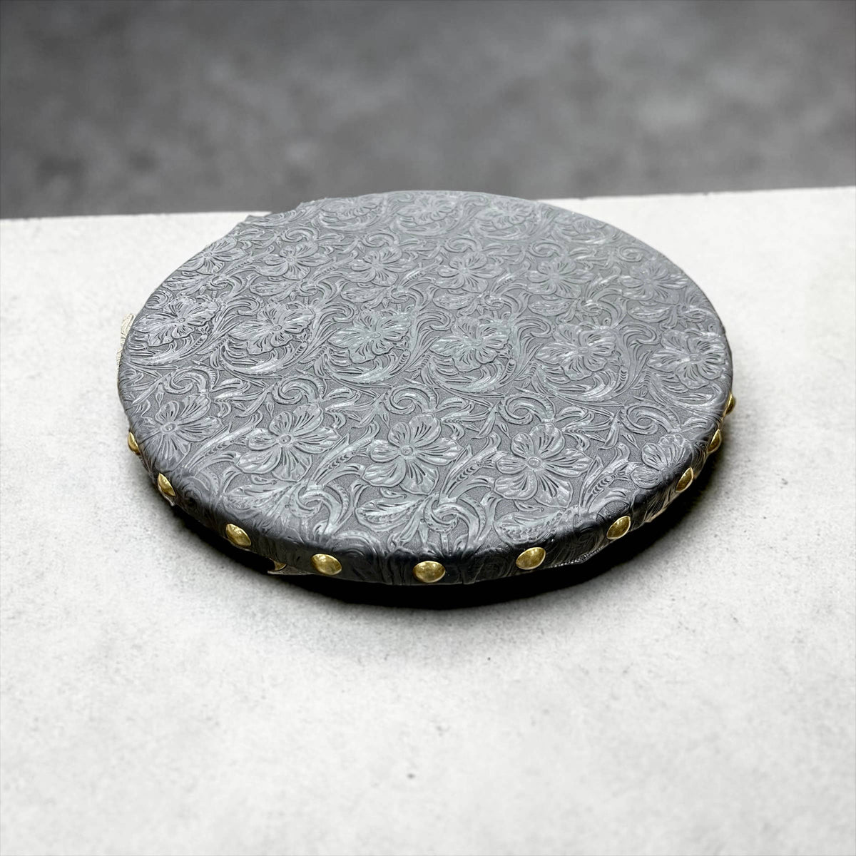 Black tooled leather lazy Susan 